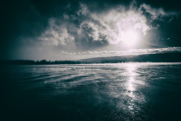 A frozen, steaming Cayuga Lake.